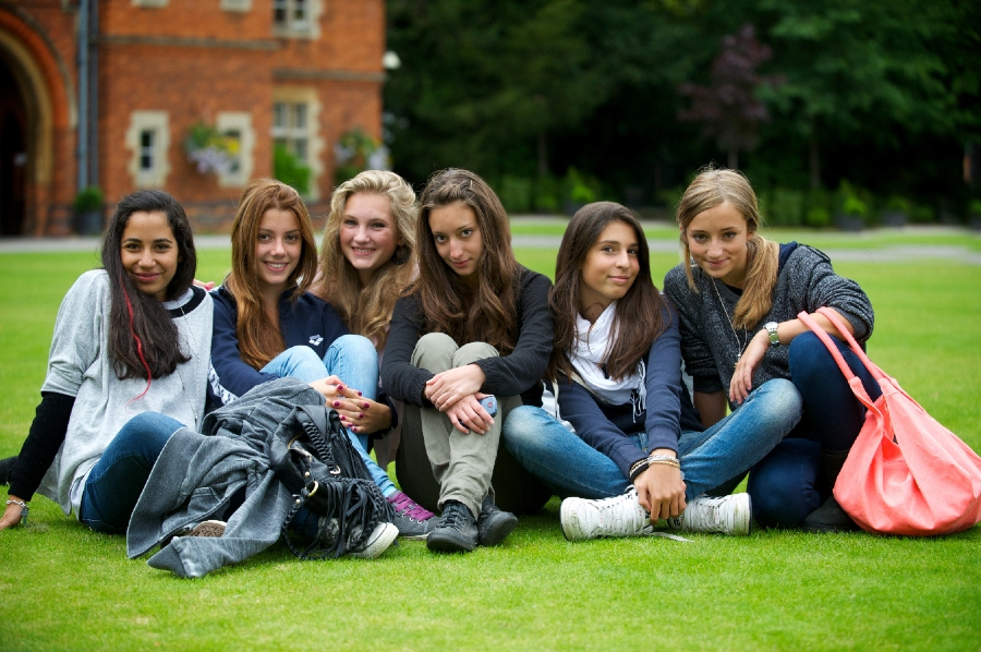 students sitting on the grass - study medicine