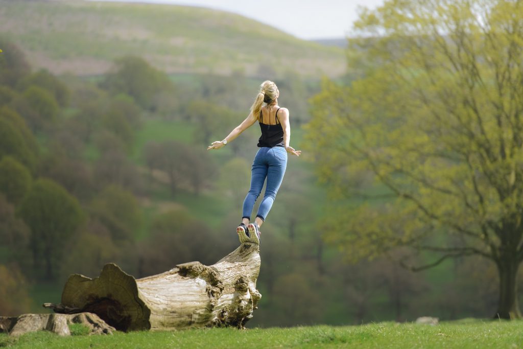 woman jumping from a tree - study medicine